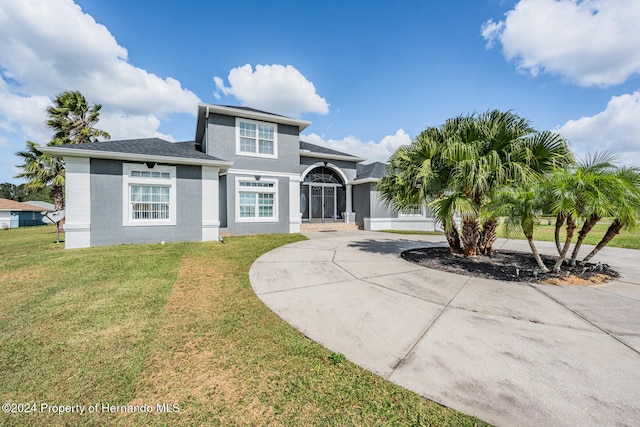 view of front of property with a front lawn