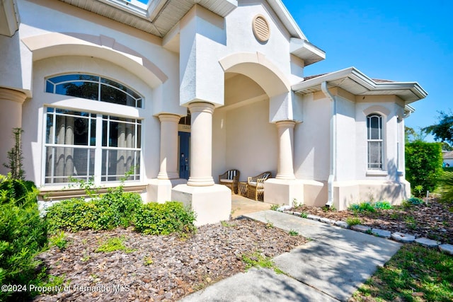 view of exterior entry featuring a porch