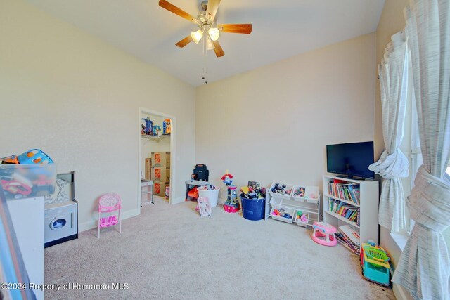 playroom with ceiling fan and carpet floors