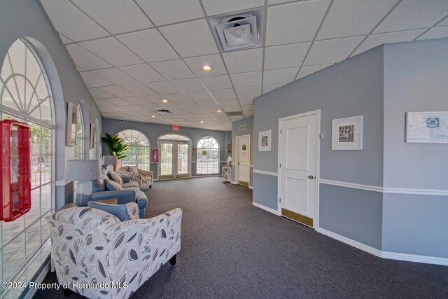 interior space featuring a paneled ceiling and french doors