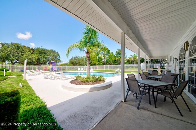 view of patio featuring a fenced in pool