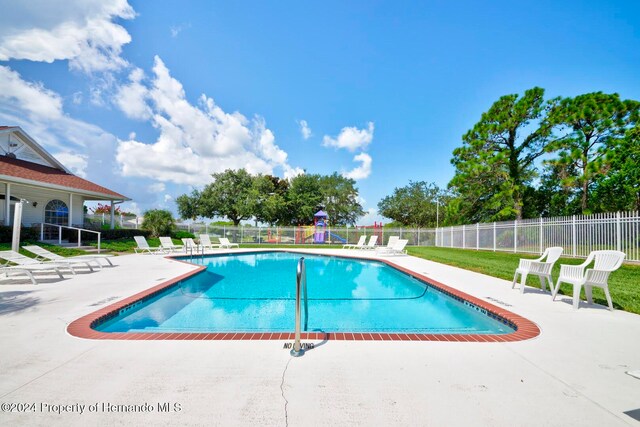 view of pool featuring a patio area