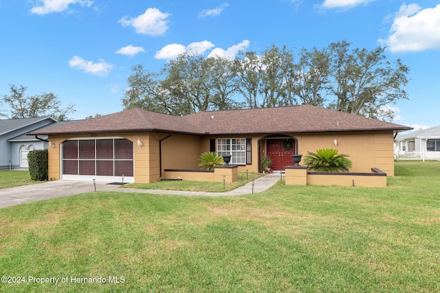 8227 Rhanbuoy Rd, Spring Hill, FL 34606 - ranch-style home featuring driveway, a garage, a front yard, stucco siding, and a shingled roof