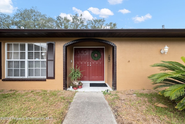 8227 Rhanbuoy Rd, Spring Hill, FL 34606 - entrance to property featuring stucco siding