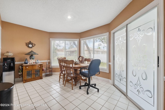 8227 Rhanbuoy Rd, Spring Hill, FL 34606 - dining area featuring baseboards and a textured ceiling