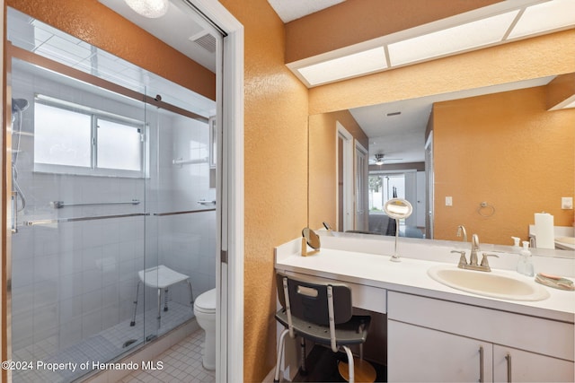 8227 Rhanbuoy Rd, Spring Hill, FL 34606 - bathroom featuring a textured wall, a stall shower, vanity, and tile patterned flooring