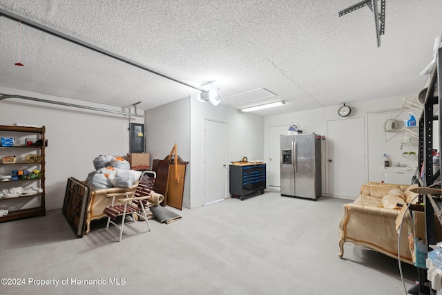 interior space featuring electric panel and stainless steel fridge with ice dispenser