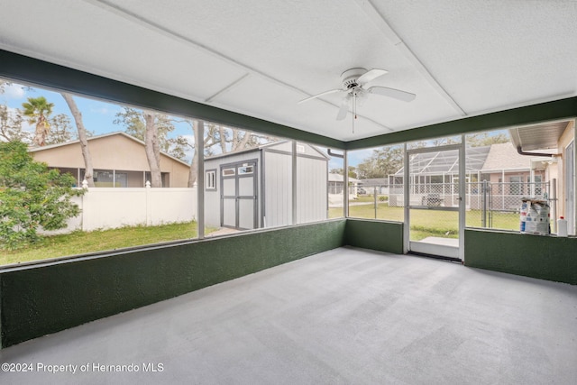 8227 Rhanbuoy Rd, Spring Hill, FL 34606 - unfurnished sunroom with a ceiling fan
