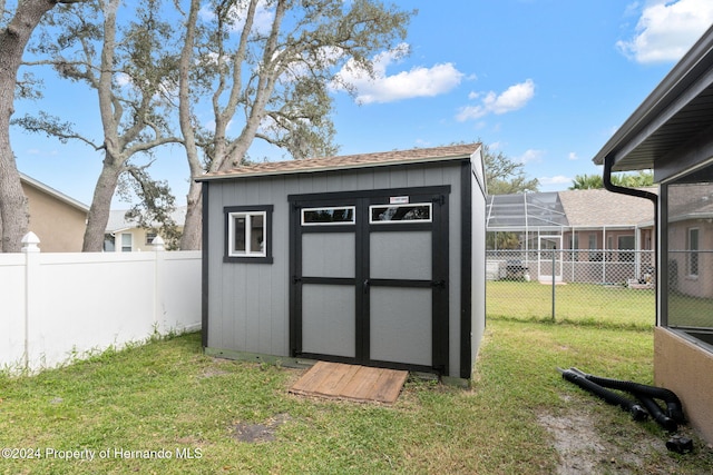 view of outdoor structure featuring a yard