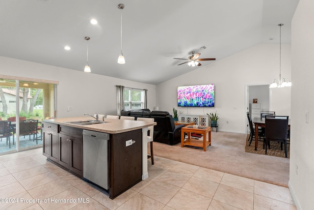 kitchen with stainless steel dishwasher, a kitchen island with sink, light colored carpet, and pendant lighting