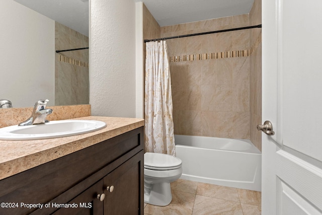 full bathroom featuring tile patterned flooring, a textured ceiling, vanity, shower / bath combo, and toilet