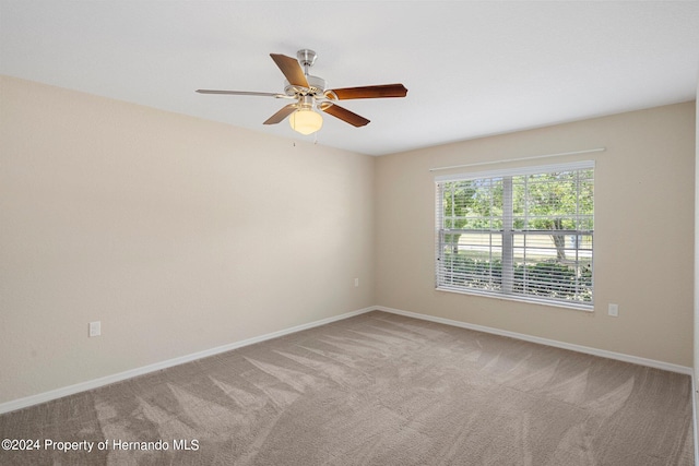 empty room featuring ceiling fan and carpet flooring