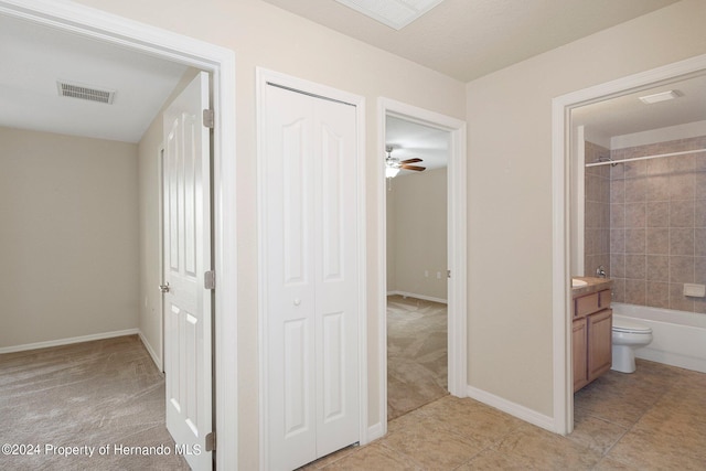 12161 Cavern Rd, Spring Hill, FL 34609 - hallway featuring light carpet and light tile patterned flooring