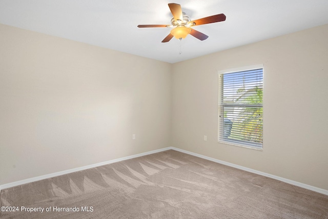 12161 Cavern Rd, Spring Hill, FL 34609 - empty room featuring light carpet and ceiling fan