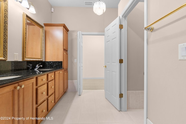 bathroom with tile patterned flooring and vanity