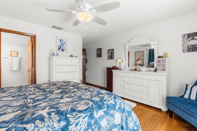 bedroom with hardwood / wood-style floors and ceiling fan