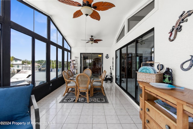 sunroom / solarium with ceiling fan and lofted ceiling