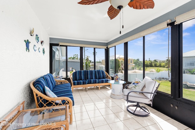 sunroom with a wealth of natural light and ceiling fan