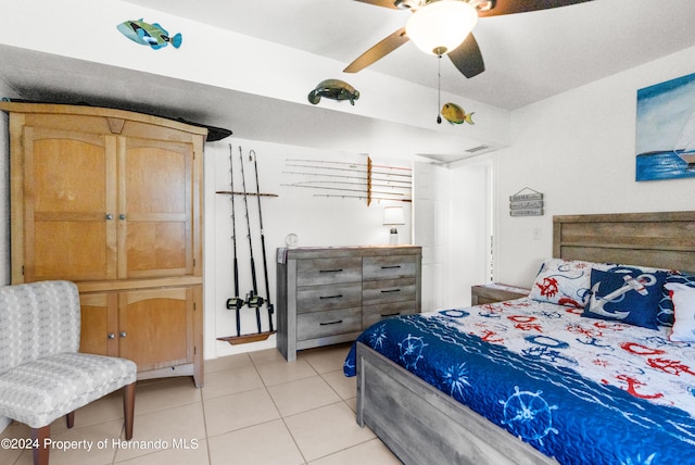 tiled bedroom with ceiling fan