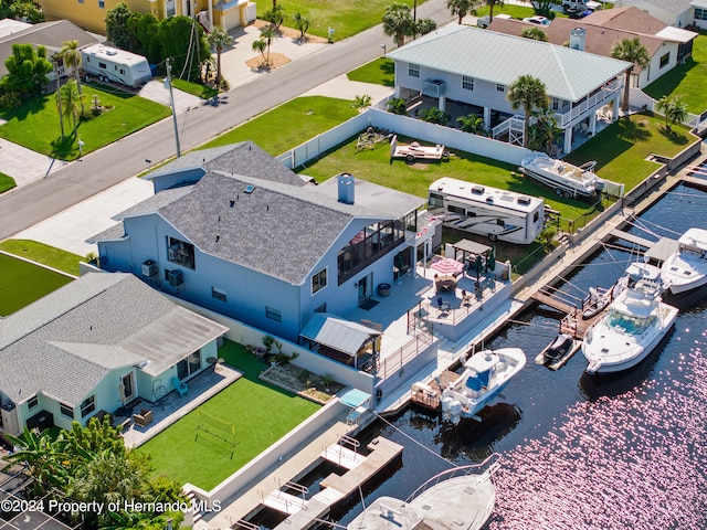 birds eye view of property featuring a water view