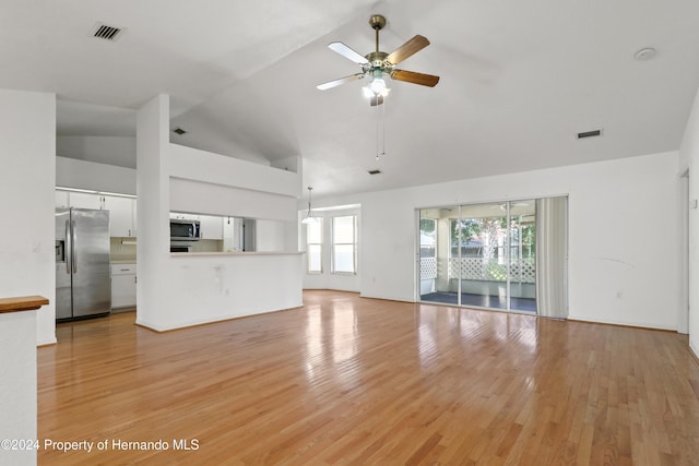 unfurnished living room with light wood-type flooring, ceiling fan, and high vaulted ceiling