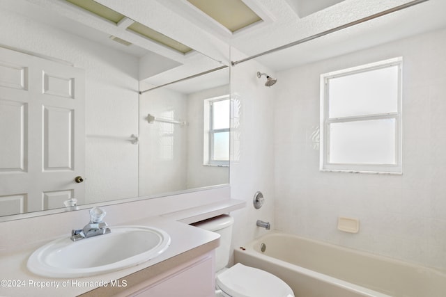 full bathroom featuring toilet, vanity, and tiled shower / bath