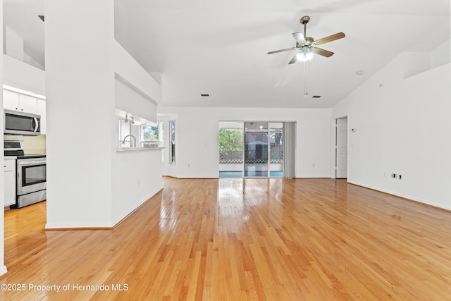 unfurnished living room featuring ceiling fan, high vaulted ceiling, and light hardwood / wood-style floors