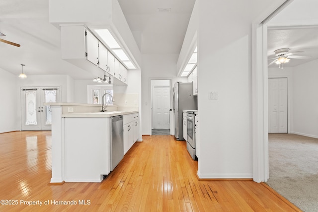 kitchen featuring white cabinetry, ceiling fan, stainless steel appliances, and sink