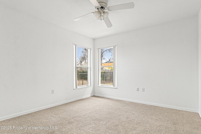 unfurnished room with carpet floors and ceiling fan