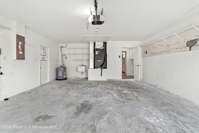 garage featuring sink, a garage door opener, water heater, electric panel, and heating unit