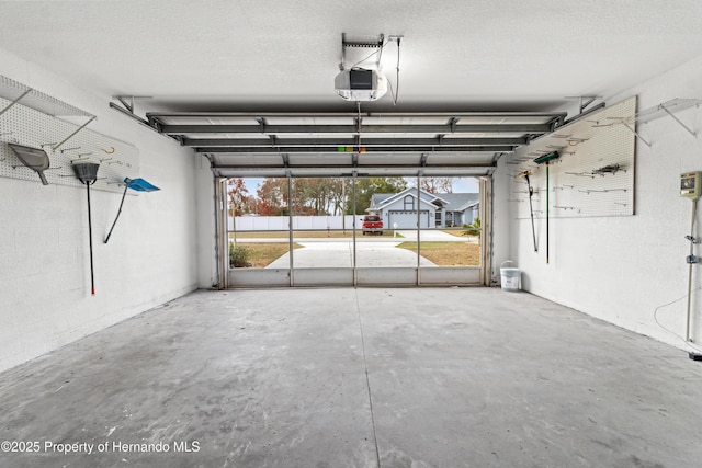 garage featuring a garage door opener