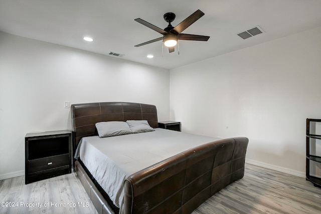 bedroom featuring light wood-type flooring and ceiling fan