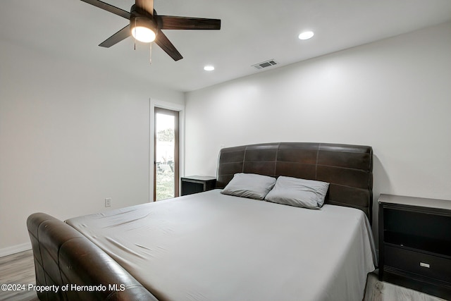 bedroom featuring ceiling fan and light hardwood / wood-style flooring