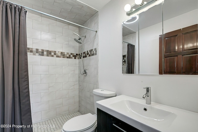 bathroom with vanity, toilet, and a shower with shower curtain