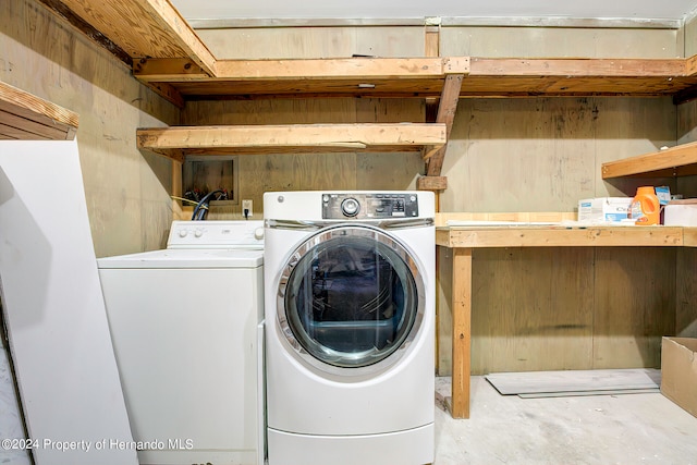 washroom with washing machine and dryer