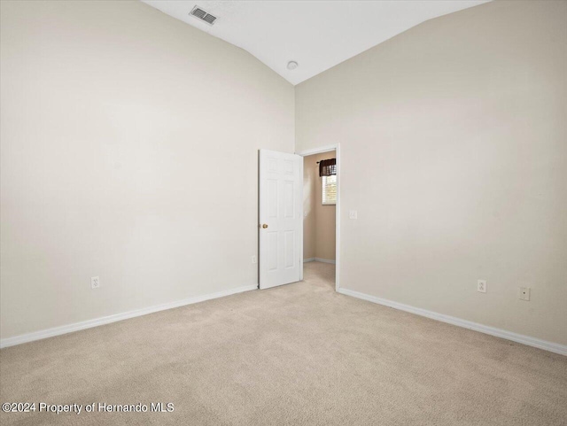 4264 Braemere Dr, Brooksville, FL 34609 - carpeted spare room with vaulted ceiling
