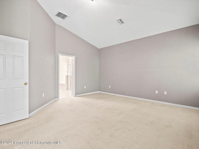 4264 Braemere Dr, Brooksville, FL 34609 - carpeted empty room with high vaulted ceiling