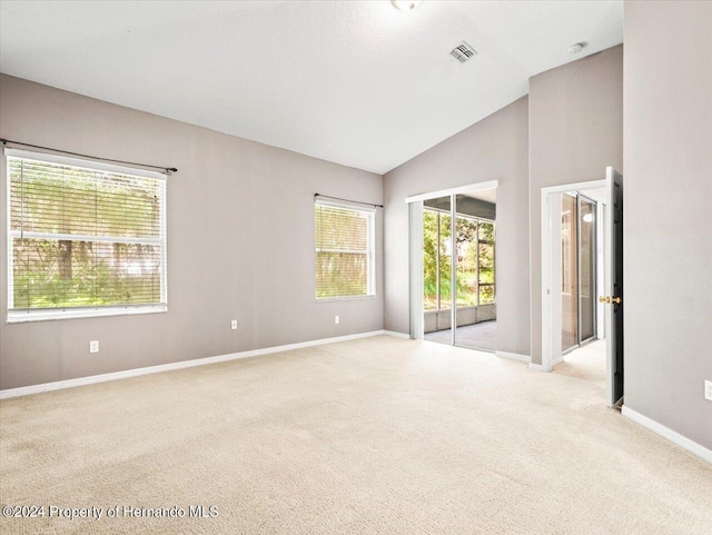 4264 Braemere Dr, Brooksville, FL 34609 - carpeted spare room with vaulted ceiling