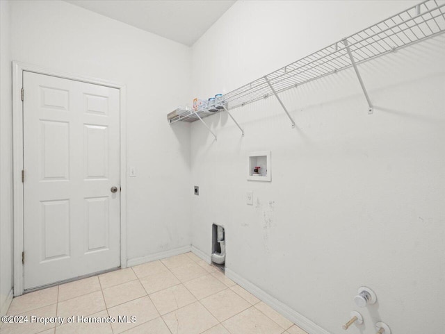 4264 Braemere Dr, Brooksville, FL 34609 - laundry area with light tile patterned floors, washer hookup, hookup for an electric dryer, and hookup for a gas dryer