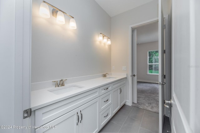 bathroom with vanity and tile patterned flooring