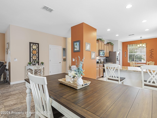 dining room featuring a chandelier