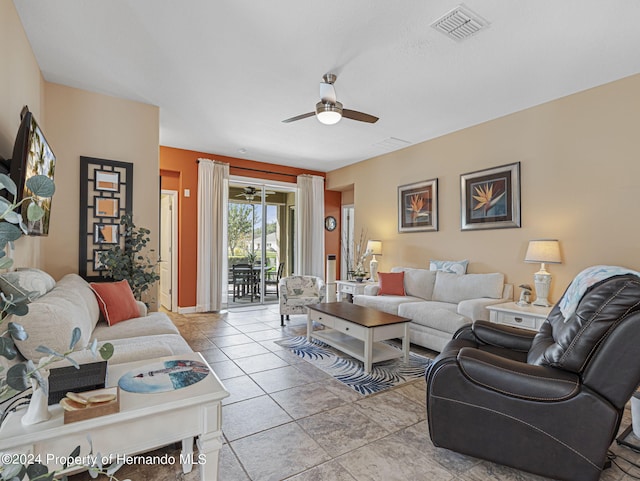 tiled living room featuring ceiling fan