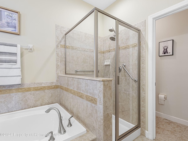 bathroom featuring shower with separate bathtub and tile patterned floors