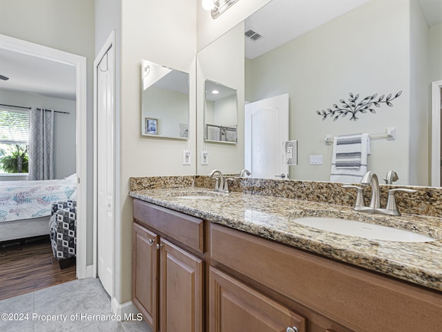 bathroom featuring vanity and hardwood / wood-style flooring