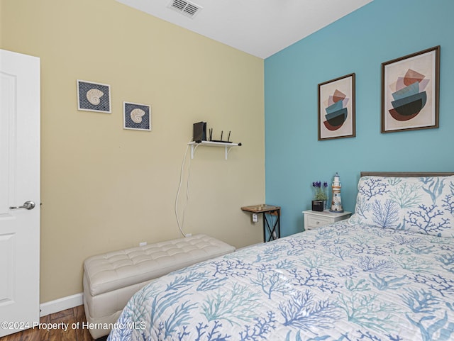 bedroom featuring wood-type flooring