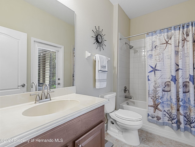 full bathroom with toilet, shower / tub combo, vanity, and tile patterned flooring