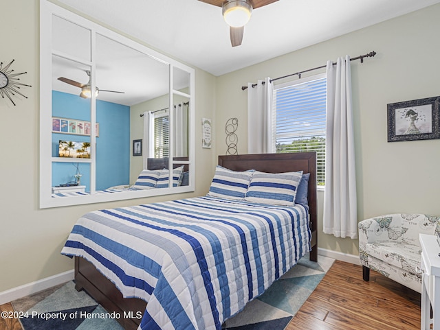 bedroom featuring hardwood / wood-style flooring and ceiling fan