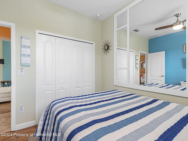 bedroom featuring hardwood / wood-style flooring and ceiling fan