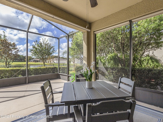 sunroom / solarium with ceiling fan