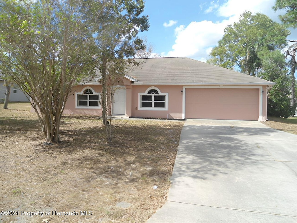 ranch-style home with a garage